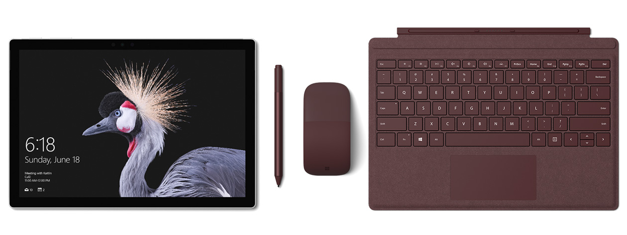 Image of Surface Pro with Surface Pro Signature Type Cover, Surface Pen and Surface Arc Mouse in burgundy. Surface Pen accompanies.