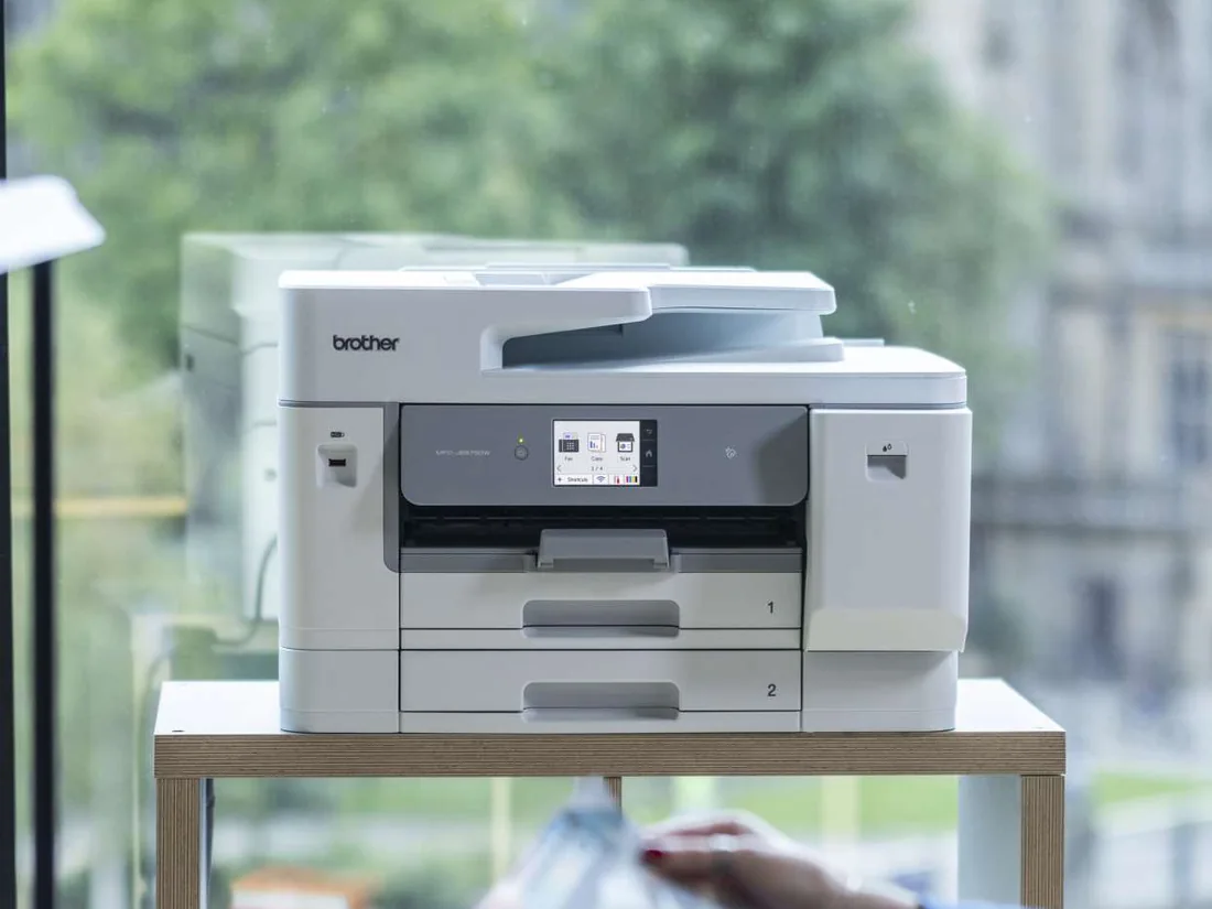 Brother business multifunction printer in a modern office setting