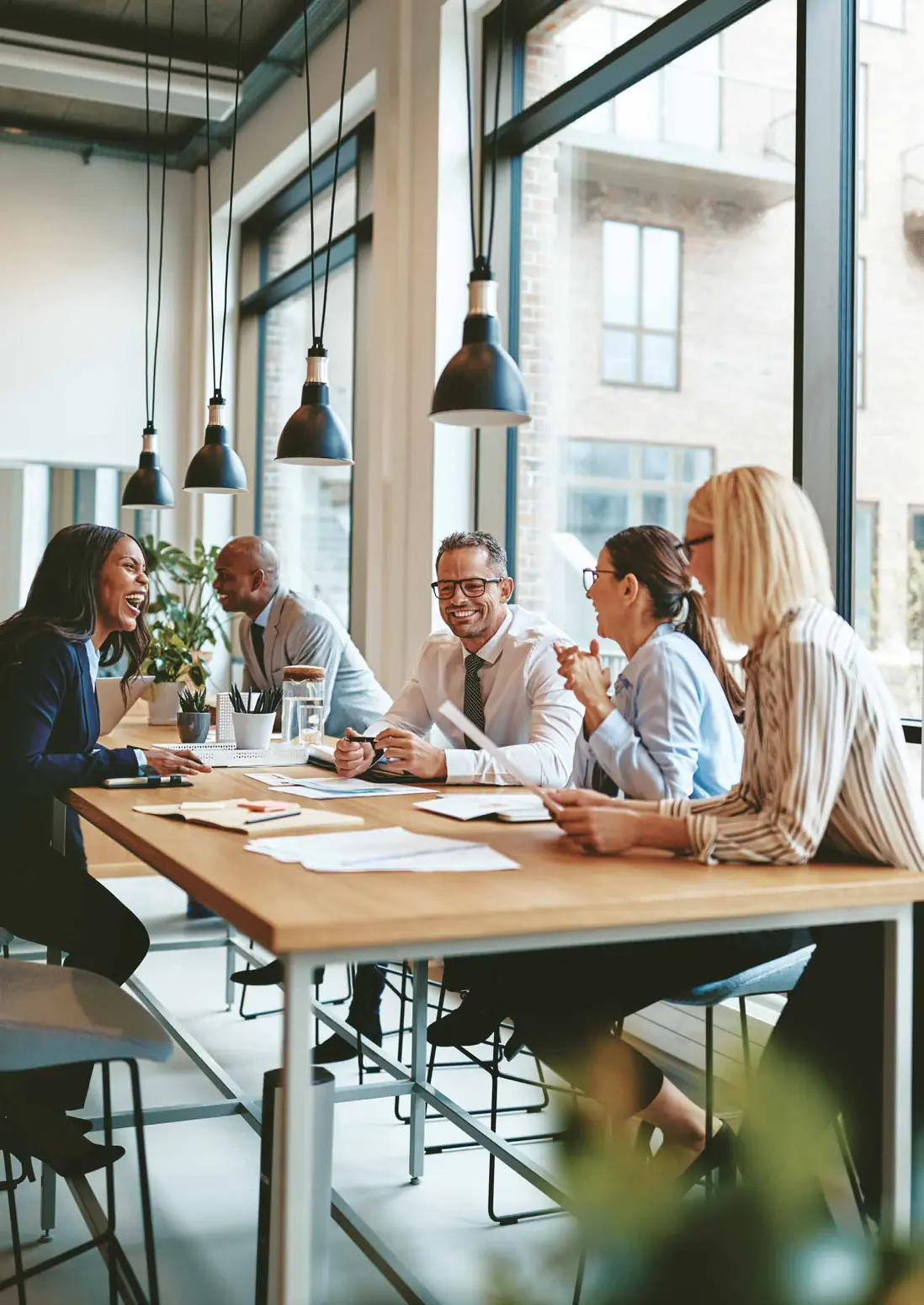 Team collaborating around a table in a modern workplace