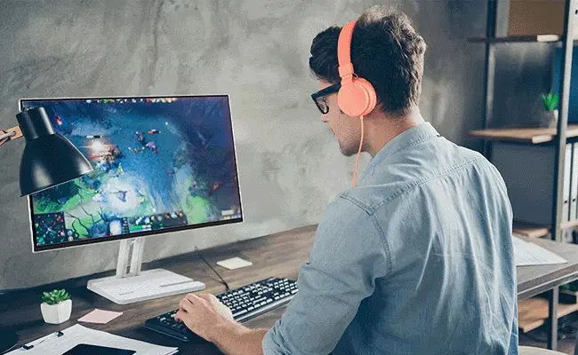 Person using a desktop monitor for everyday computing